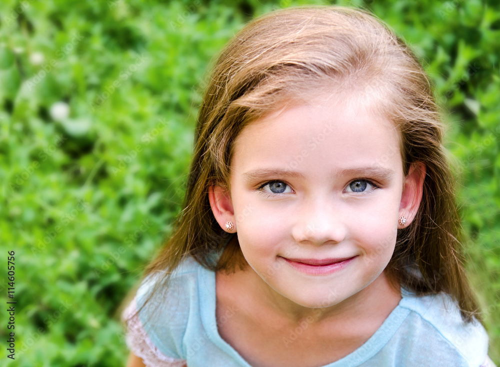 Portrait of smiling cute little girl in summer day Portrait of smiling cute little girl in summer day