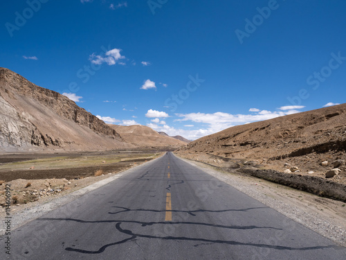Asphalt road with blue sky and mountain