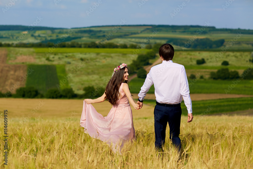 Young couple in a romantic place. Couple in love outdoors in a w