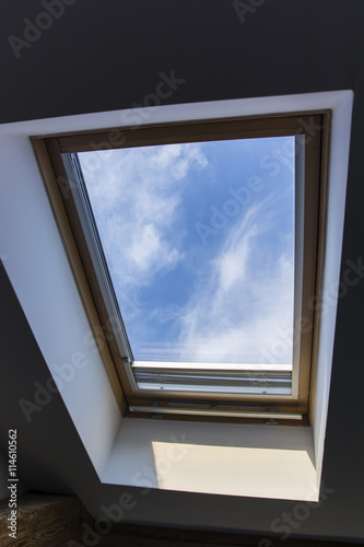 roof hung window with a view of the sky from the room