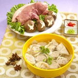 Traditional Chinese bowl of wanton noodle with pork and mushroom on the table