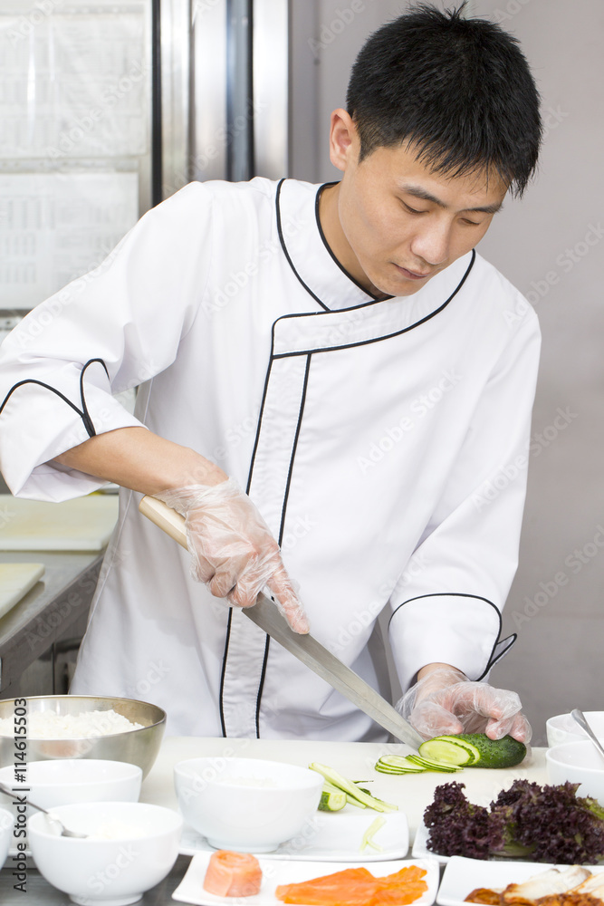Japanese chef preparing a meal in a restaurant Japanese chef preparing a meal in a restaurant