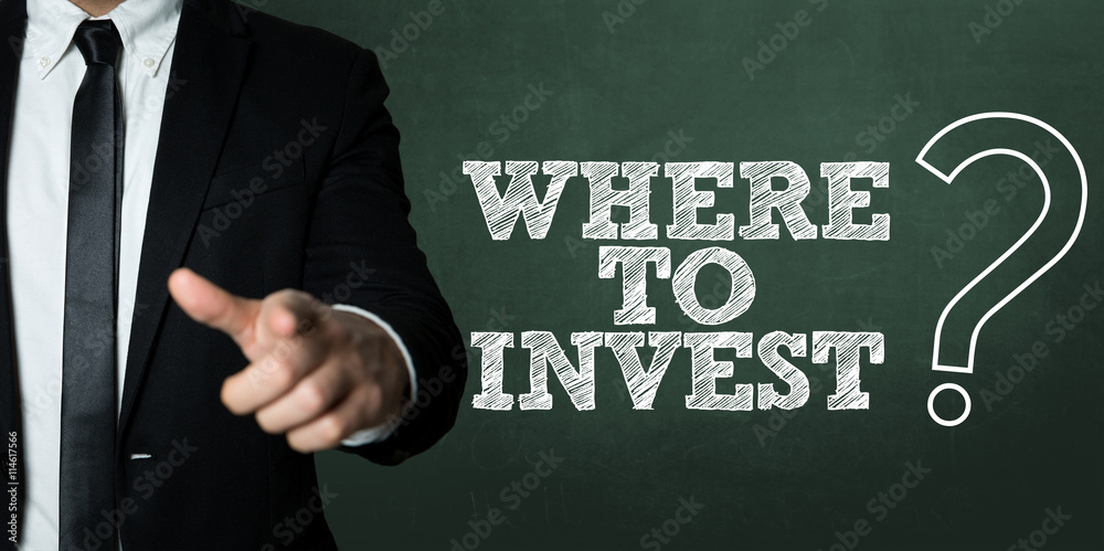 Business man pointing with the text: Where to Invest? Business man pointing with the text: Where to Invest?