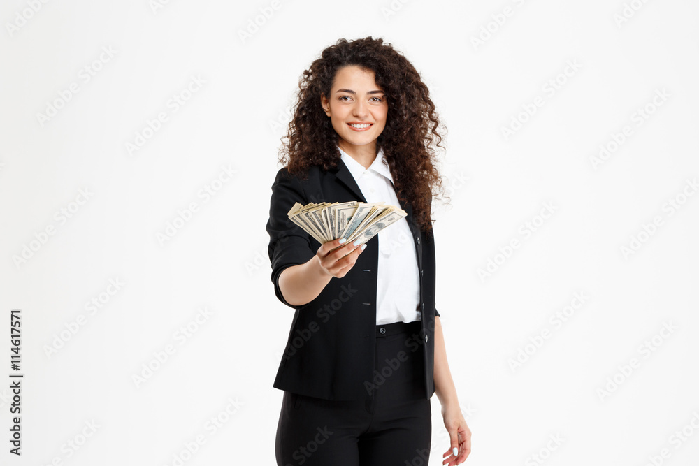 Picture of cheerful curly business girl holding money Picture of cheerful curly business girl holding money