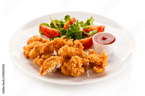 Fried chicken nuggets and vegetables