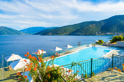 Swimming pool with sea and mountain view on coast of Kefalonia island in Agia Efimia village, Greece