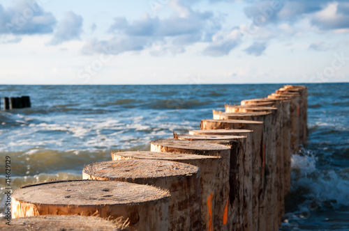 Breakwater on sea and blue sky