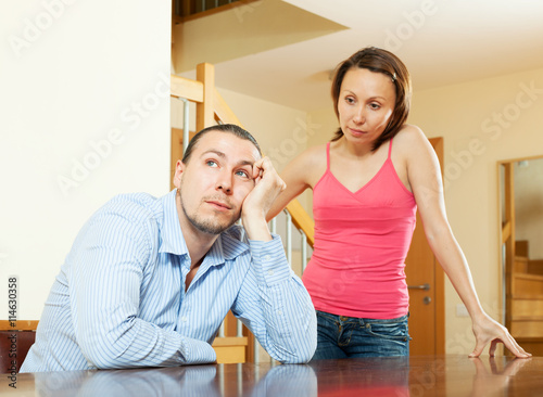 Family conflict. Couple after quarrel photo