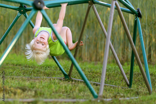 Photography Little Child Playing at PLayground Climbing on Monkey Bars