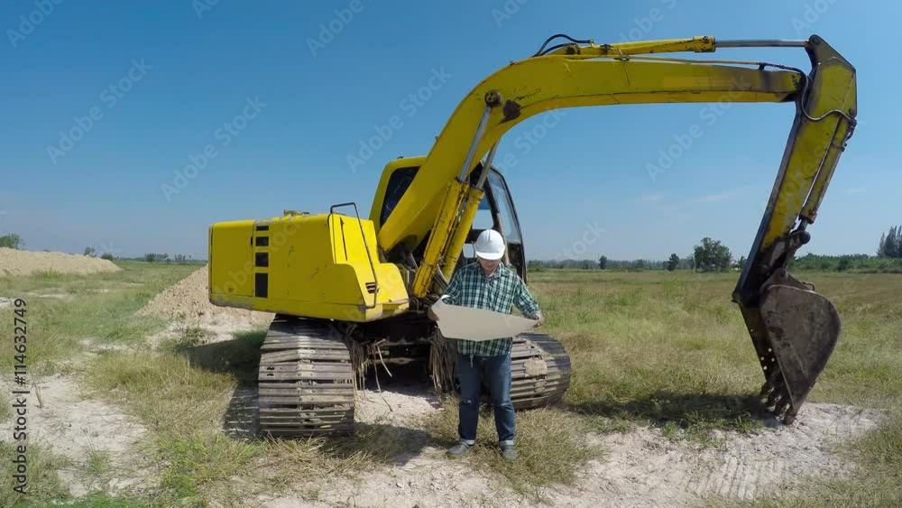 The construction work was looking at the plans new The construction work was looking at the plans new