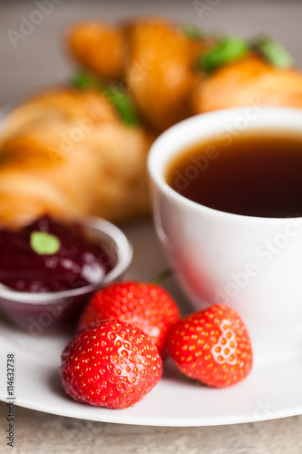 breakfast with croissants,coffee and juice on natural background