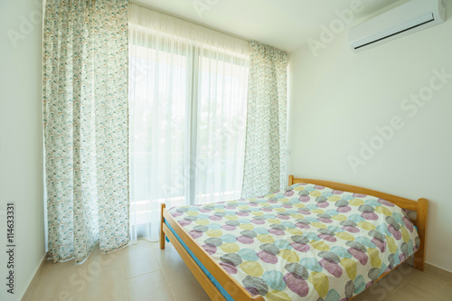 Interior of a lbedroom in a guest house photo