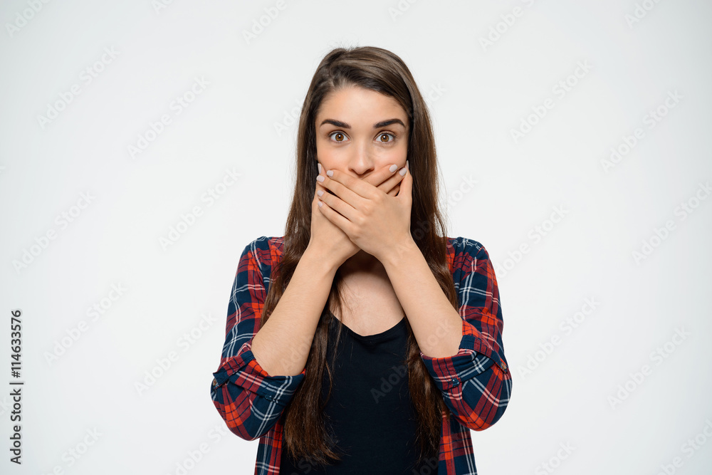 Dissapointed young girl covering her mouth. Dissapointed young girl covering her mouth.
