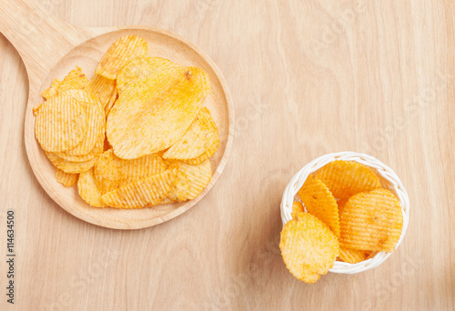 Potato chips in wooden plate