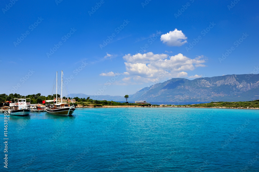 Beautiful seascape with boats in blue bay. Aegean sea. Turkey