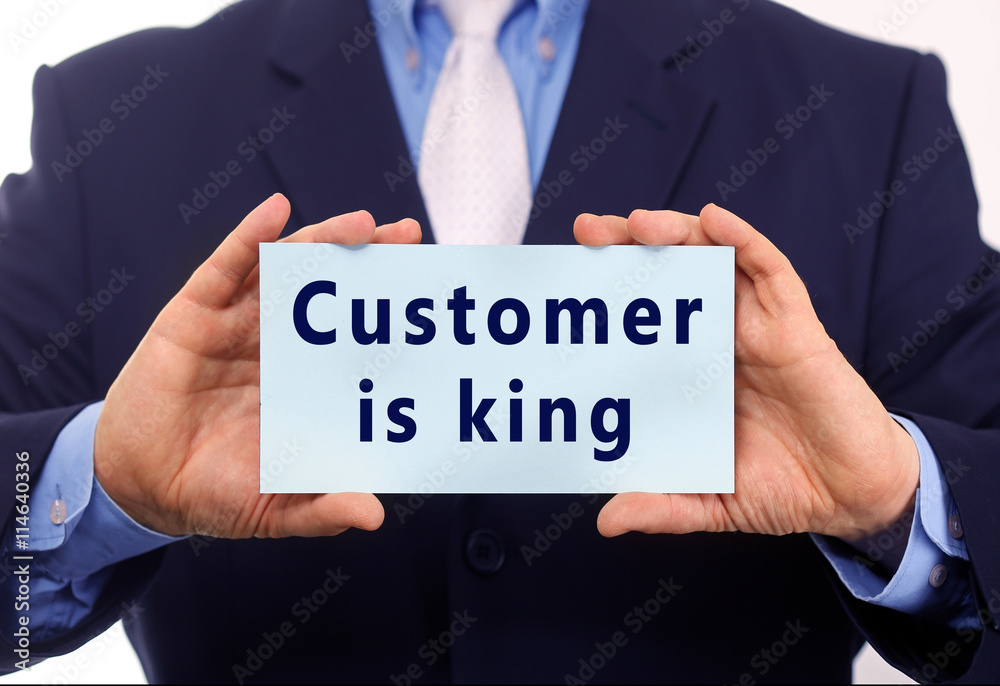 Business man hold paper customer is king text on it Business man hold paper customer is king text on it
