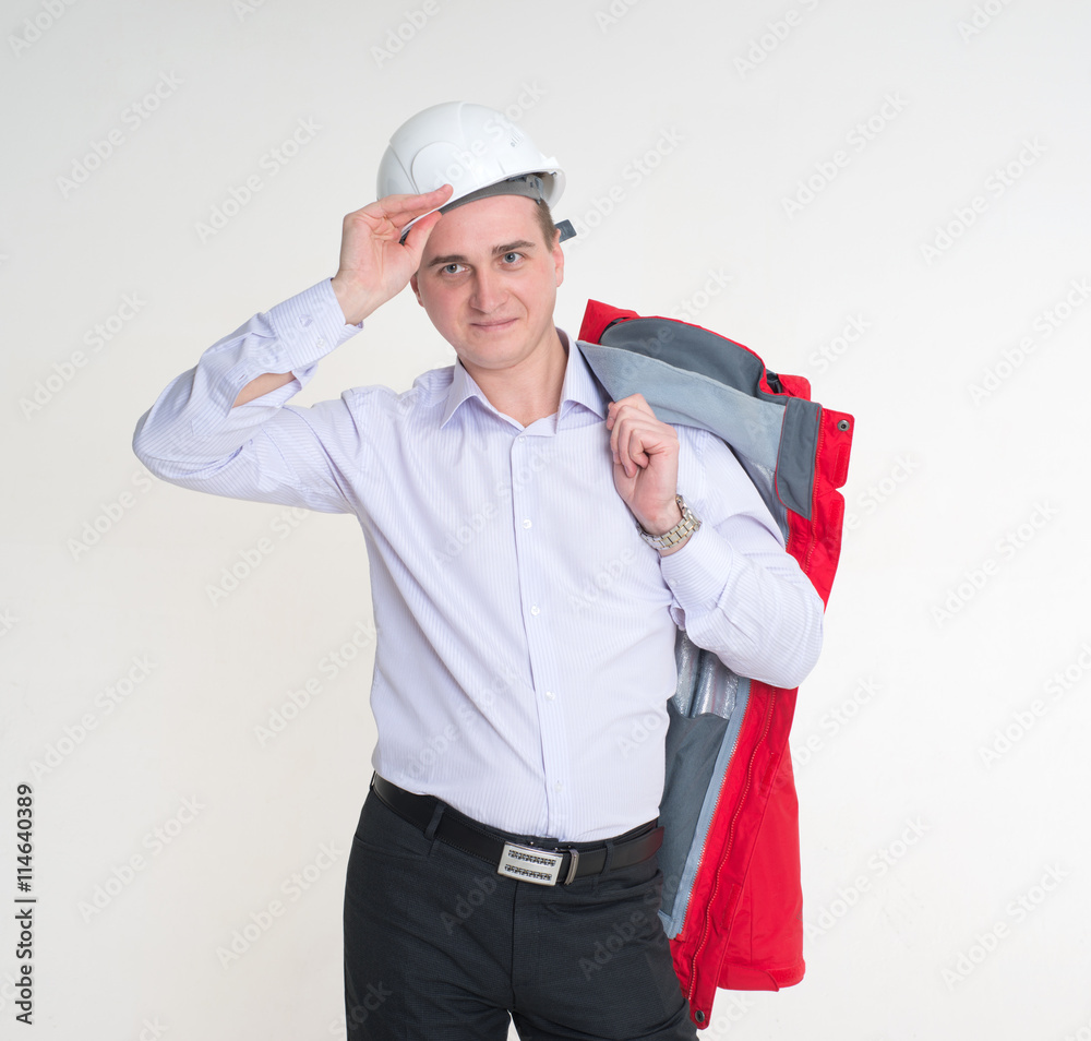 A man in a white construction helmet and a strict dress A man in a white construction helmet and a strict dress