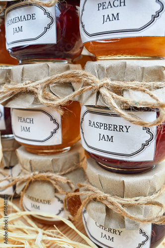 Home made jam on a wooden shelf
