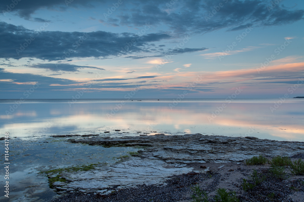 Obraz premium The night before midsummer eve in Sweden and as always in Scandinavia during summertime the light outside over the ocean is magical.