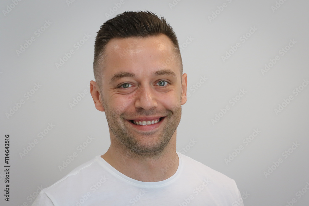 Portrait of young handsome man in white T-shirt Portrait of young handsome man in white T-shirt