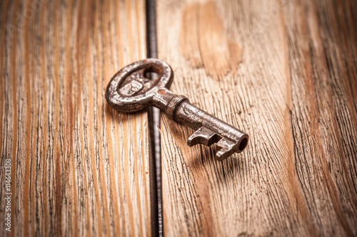 old key on a brown wooden background