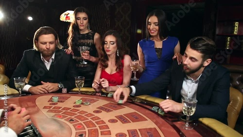 People Placing Their Bets on the Blackjack Table