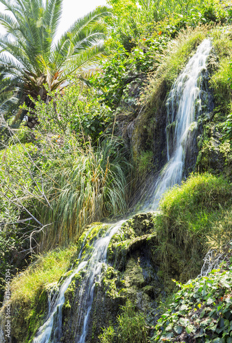 Waterfall in the meditation Garden in Santa Monica, United States. Park of five religions at the lake Shrine, landscape. 