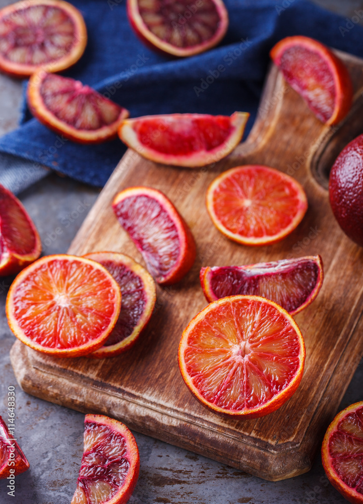 blood orange on a wooden Board,cut into wedges.selective focus. blood orange on a wooden Board,cut into wedges.selective focus.