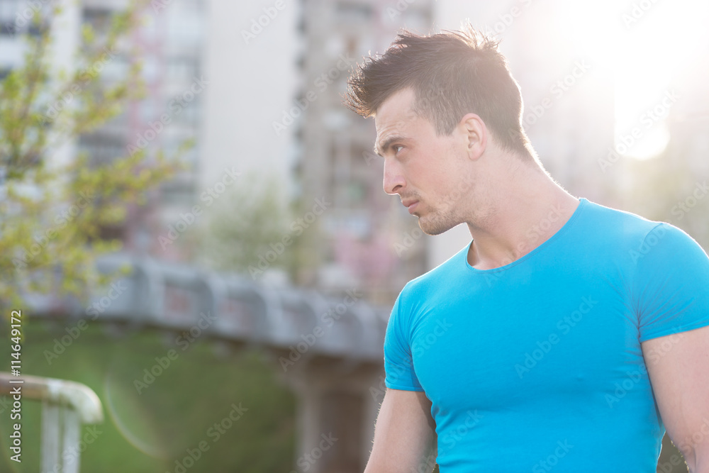Fototapeta premium Portrait Of Athletic Man With Fit Muscular Body Resting After Jo