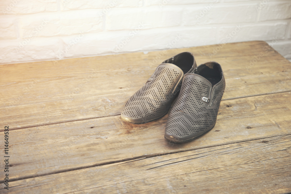 man shoes on wooden background man shoes on wooden background