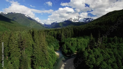 Fly away from Snowy Mountain Mt Baker Nooksack River Aerial photo