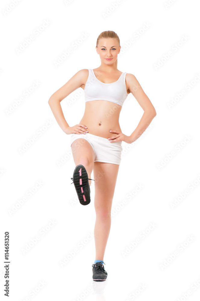 Fitness woman doing stretching exercise, full length portrait isolated over white background Fitness woman doing stretching exercise, full length portrait isolated over white background