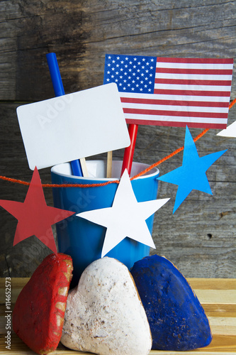  cookies color red, blue, white. Cup of coffee (tea), USA flag, decoration on old wooden table. Patriotic party Concept - information holidays, dates and events photo