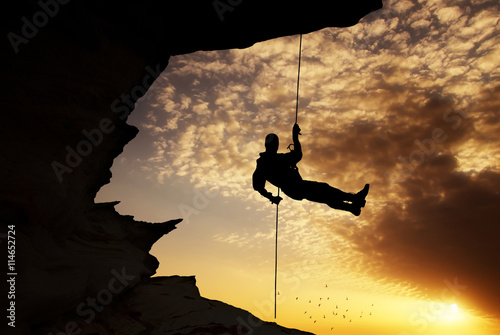 Silhouette of rock climber