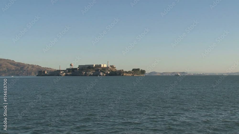 Still Alcatraz in the morning with ferry at the background Still Alcatraz in the morning with ferry at the background