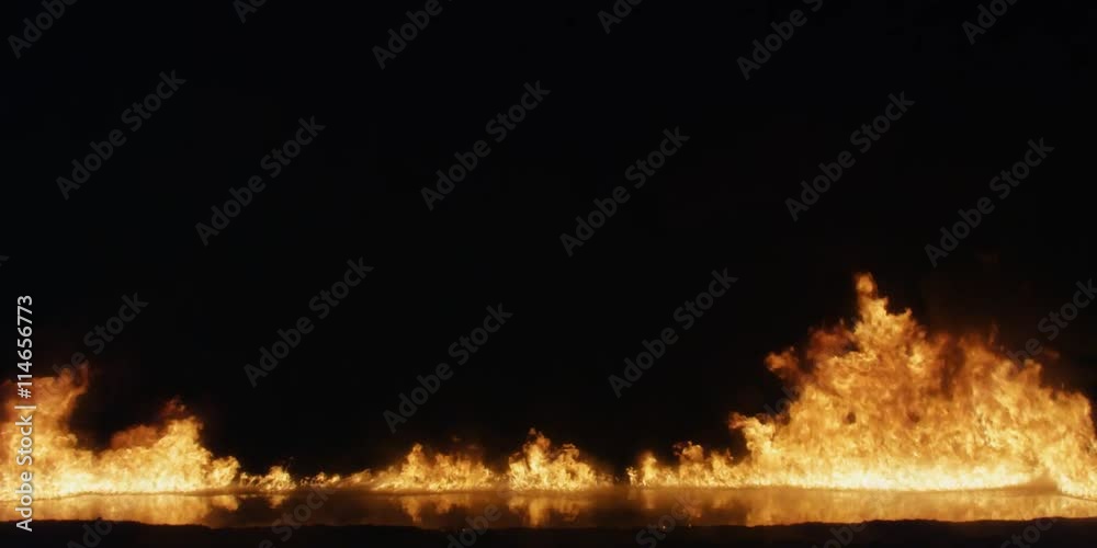 Flames burning across the screen but seldom as high as center frame Flames burning across the screen but seldom as high as center frame