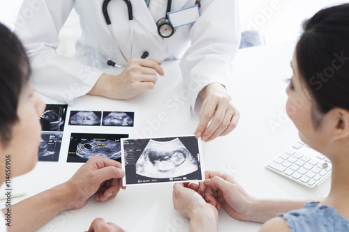 The couple have been passed an echo photo of the baby from the doctor at the hospital