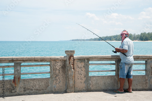 People fishing on the harbor bridge