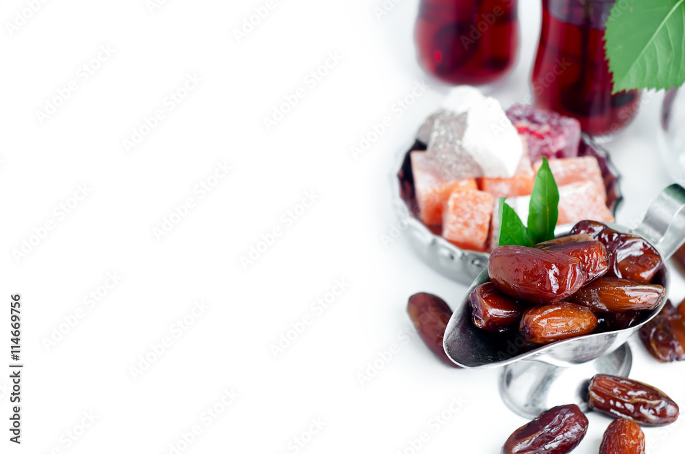Traditional arabic tea set and dried dates. Traditional arabic tea set and dried dates.
