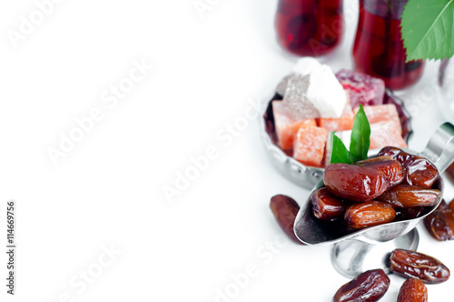 Traditional arabic tea set and dried dates.