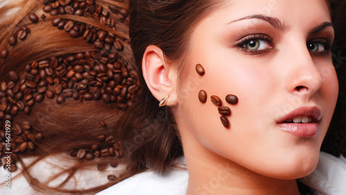 woman's face with coffee beans