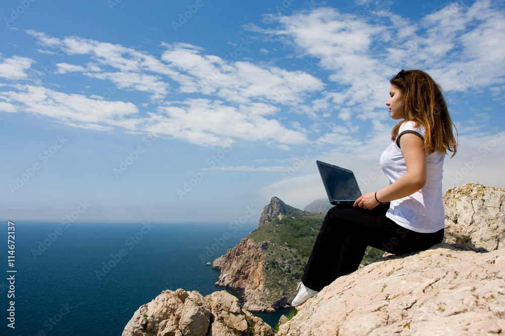 woman with laptop and nature