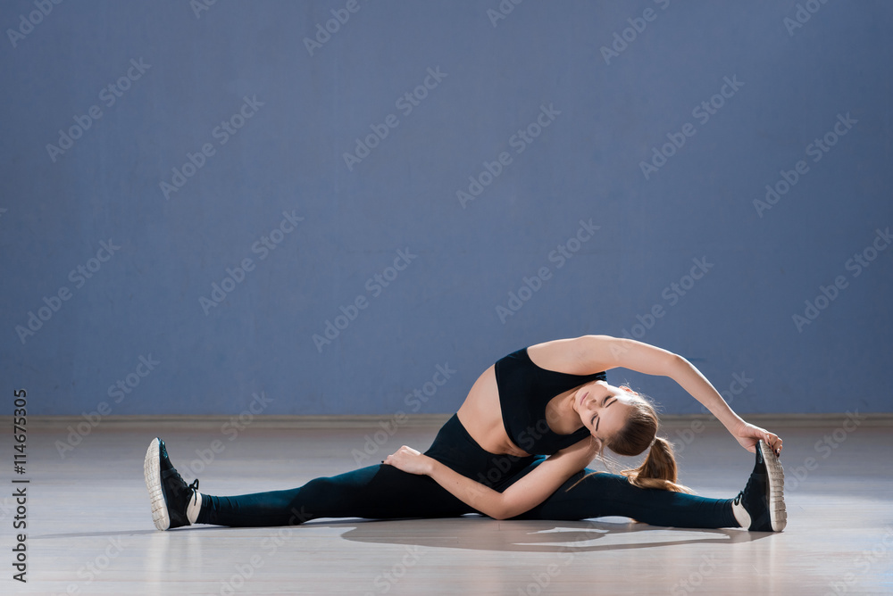 Beautiful yoga woman practice in a training hall background. Yoga concept.