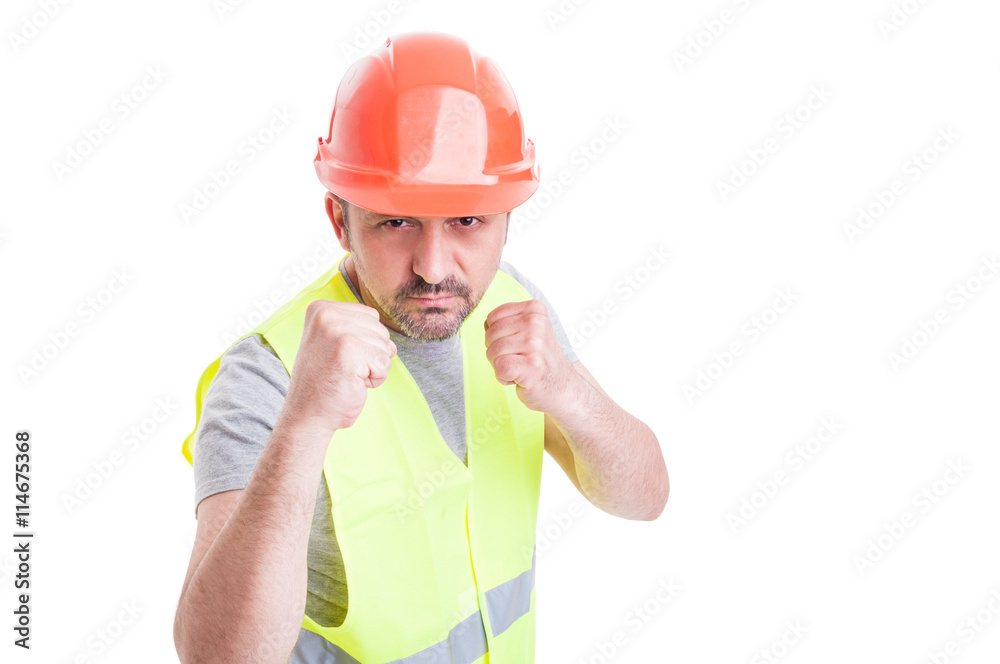 Aggressive handsome constructor acting violent and fighting