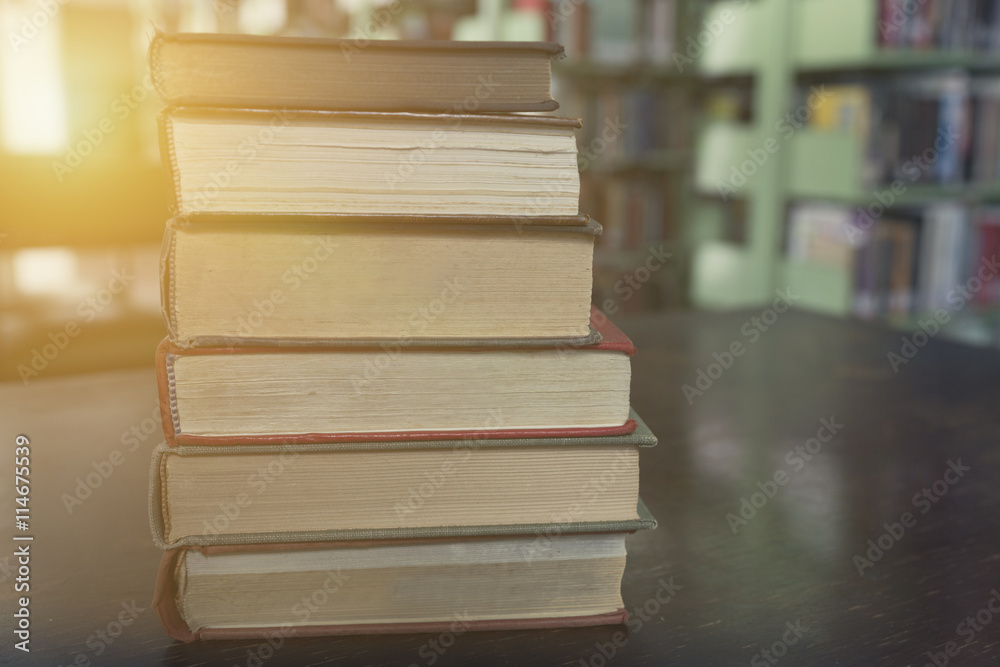 old book with blur library background old book with blur library background