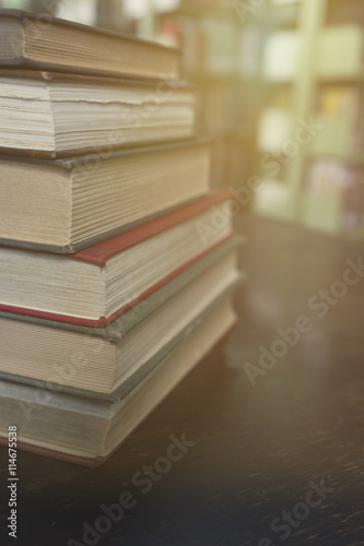 old book with blur library background © 88studio