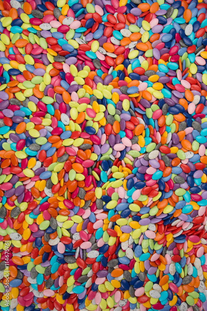 Multicolor bonbon sweets (ball candies or chocolate dragees) on background