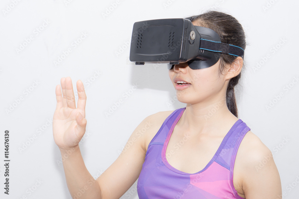 Beautiful young brunette with long hair wearing virtual reality Beautiful young brunette with long hair wearing virtual reality