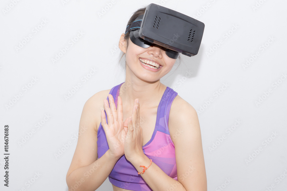 Beautiful young brunette with long hair wearing virtual reality Beautiful young brunette with long hair wearing virtual reality
