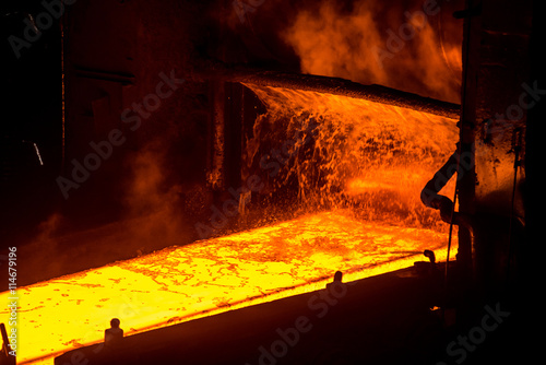 Tablou pe pânză Sheet of hot metal on the conveyor belt